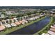 Lakeside community with single-Gathering homes and lush landscaping at 4949 Sandy Brook Cir, Wimauma, FL 33598