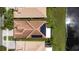 Aerial view of the tile roof of this home, complete with solar panels and screened-in lanai at 4949 Sandy Brook Cir, Wimauma, FL 33598