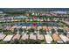 Overhead aerial view of a home in a lakeside community with a pin on the home at 4949 Sandy Brook Cir, Wimauma, FL 33598