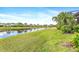 Beautiful waterfront property with manicured lawn and serene views at 4949 Sandy Brook Cir, Wimauma, FL 33598