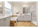 Bathroom showcasing double vanity, large tub, and walk-in shower at 4949 Sandy Brook Cir, Wimauma, FL 33598
