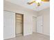 Neutral toned bedroom with an open closet featuring built in shelving at 4949 Sandy Brook Cir, Wimauma, FL 33598