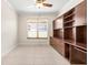 Empty home office with custom built-in cabinetry providing ample storage and work space at 4949 Sandy Brook Cir, Wimauma, FL 33598
