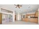 Bright and airy living room with tile floors, neutral tones, and lots of windows and natural light at 4949 Sandy Brook Cir, Wimauma, FL 33598