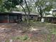 Large backyard with mature trees and shed at 709 1St Ne Ave, Largo, FL 33770