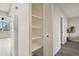 Empty pantry with white shelves and louvered doors at 5095 Bay Ne St # 306, St Petersburg, FL 33703