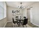 Modern dining room with glass table and black leather chairs at 5095 Bay Ne St # 306, St Petersburg, FL 33703