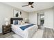 Well-lit bedroom with a queen bed, modern decor and a view at 5095 Bay Ne St # 306, St Petersburg, FL 33703