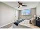 Light and airy bedroom with a queen bed and ceiling fan at 5095 Bay Ne St # 306, St Petersburg, FL 33703
