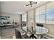 Modern dining area with glass table and black leather chairs at 5095 Bay Ne St # 306, St Petersburg, FL 33703