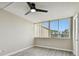 Bedroom with gray flooring, ceiling fan and a window with vertical blinds at 5095 Bay Ne St # 306, St Petersburg, FL 33703
