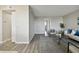 Living room features gray flooring, and a view of the sofa and chair at 5095 Bay Ne St # 306, St Petersburg, FL 33703