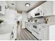Renovated kitchen featuring white cabinets and quartz countertops at 5095 Bay Ne St # 306, St Petersburg, FL 33703