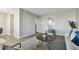 Open living area with gray wood floors and neutral decor at 5095 Bay Ne St # 306, St Petersburg, FL 33703