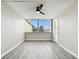 Spacious bedroom with gray vinyl flooring and large windows at 5095 Bay Ne St # 306, St Petersburg, FL 33703