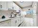 Modern white kitchen with new appliances at 5095 Bay Ne St # 306, St Petersburg, FL 33703
