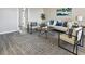 Bright living room features a comfy sofa, accent chairs, and a stylish coffee table at 5095 Bay Ne St # 306, St Petersburg, FL 33703
