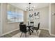 Modern dining room with glass table and black leather chairs at 5095 Bay Ne St # 306, St Petersburg, FL 33703