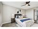 Relaxing bedroom with a queen bed, ceiling fan, and stylish decor at 5095 Bay Ne St # 306, St Petersburg, FL 33703