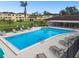 Inviting community pool with lounge chairs and patio area at 5095 Bay Ne St # 306, St Petersburg, FL 33703