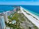 Expansive beachfront view with resort buildings and lush landscaping at 1200 Gulf Blvd # 105, Clearwater Beach, FL 33767