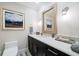 Sophisticated bathroom with a floating vanity and geometric wallpaper at 1200 Gulf Blvd # 105, Clearwater Beach, FL 33767