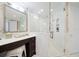 Bathroom with walk-in shower, marble finishes and modern vanity at 1200 Gulf Blvd # 105, Clearwater Beach, FL 33767
