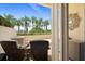 Private patio with wicker furniture and tropical views at 1200 Gulf Blvd # 105, Clearwater Beach, FL 33767