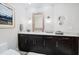 Modern bathroom with floating vanity and geometric wallpaper at 1200 Gulf Blvd # 105, Clearwater Beach, FL 33767
