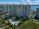 Aerial view of resort community highlighting the pool and tennis court at 1200 Gulf Blvd # 105, Clearwater Beach, FL 33767
