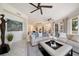Comfortable living room with sectional sofa and large artwork at 1200 Gulf Blvd # 105, Clearwater Beach, FL 33767