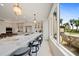 Gourmet kitchen boasts expansive island, high-end appliances, and stunning water views at 1200 Gulf Blvd # 105, Clearwater Beach, FL 33767