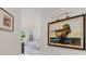 Hallway featuring artwork and a glimpse into a bedroom beyond at 1200 Gulf Blvd # 105, Clearwater Beach, FL 33767