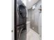 Clean laundry room, featuring a stackable washer and dryer set at 1200 Gulf Blvd # 105, Clearwater Beach, FL 33767