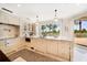 Bright kitchen features marble countertops and ocean views at 1200 Gulf Blvd # 105, Clearwater Beach, FL 33767