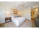 Spacious bedroom with a large bed, ample lighting, and hardwood floors at 1200 Gulf Blvd # 105, Clearwater Beach, FL 33767