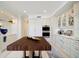 Modern kitchen featuring double ovens, custom cabinetry, and a large island at 1200 Gulf Blvd # 105, Clearwater Beach, FL 33767