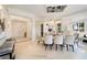 Bright and spacious entryway with bench and view to dining room at 1200 Gulf Blvd # 105, Clearwater Beach, FL 33767