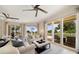 Bright living room with ample natural light and balcony access at 1200 Gulf Blvd # 105, Clearwater Beach, FL 33767