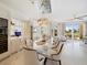 Open concept dining room with glass table and ocean views at 1200 Gulf Blvd # 105, Clearwater Beach, FL 33767
