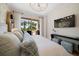 Comfortable bedroom with a king-size bed and stunning balcony view at 1200 Gulf Blvd # 105, Clearwater Beach, FL 33767