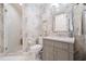Modern bathroom with gray vanity and patterned wallpaper at 1200 Gulf Blvd # 105, Clearwater Beach, FL 33767