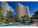 Relaxing resort-style pool with surrounding palm trees and building at 1200 Gulf Blvd # 105, Clearwater Beach, FL 33767