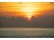 Stunning sunset over the ocean, creating a beautiful and serene atmosphere at 1200 Gulf Blvd # 105, Clearwater Beach, FL 33767