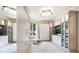 Spacious walk-in closet with ample storage, built in TV and seating area at 1200 Gulf Blvd # 105, Clearwater Beach, FL 33767