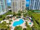 Inviting resort-style pool and spa area with ample lounge chairs at 1200 Gulf Blvd # 105, Clearwater Beach, FL 33767