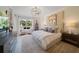 Spacious main bedroom features a king-size bed, and large windows with water views at 1200 Gulf Blvd # 105, Clearwater Beach, FL 33767