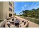 Circular patio seating area with fire pit and lovely views at 1200 Gulf Blvd # 105, Clearwater Beach, FL 33767