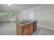 Kitchen island with granite countertop and double sink at 11405 Quiet Forest Dr, Tampa, FL 33635