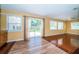 Bright dining area with hardwood floors and sliding glass doors to backyard at 7051 Hibiscus S Ave, South Pasadena, FL 33707